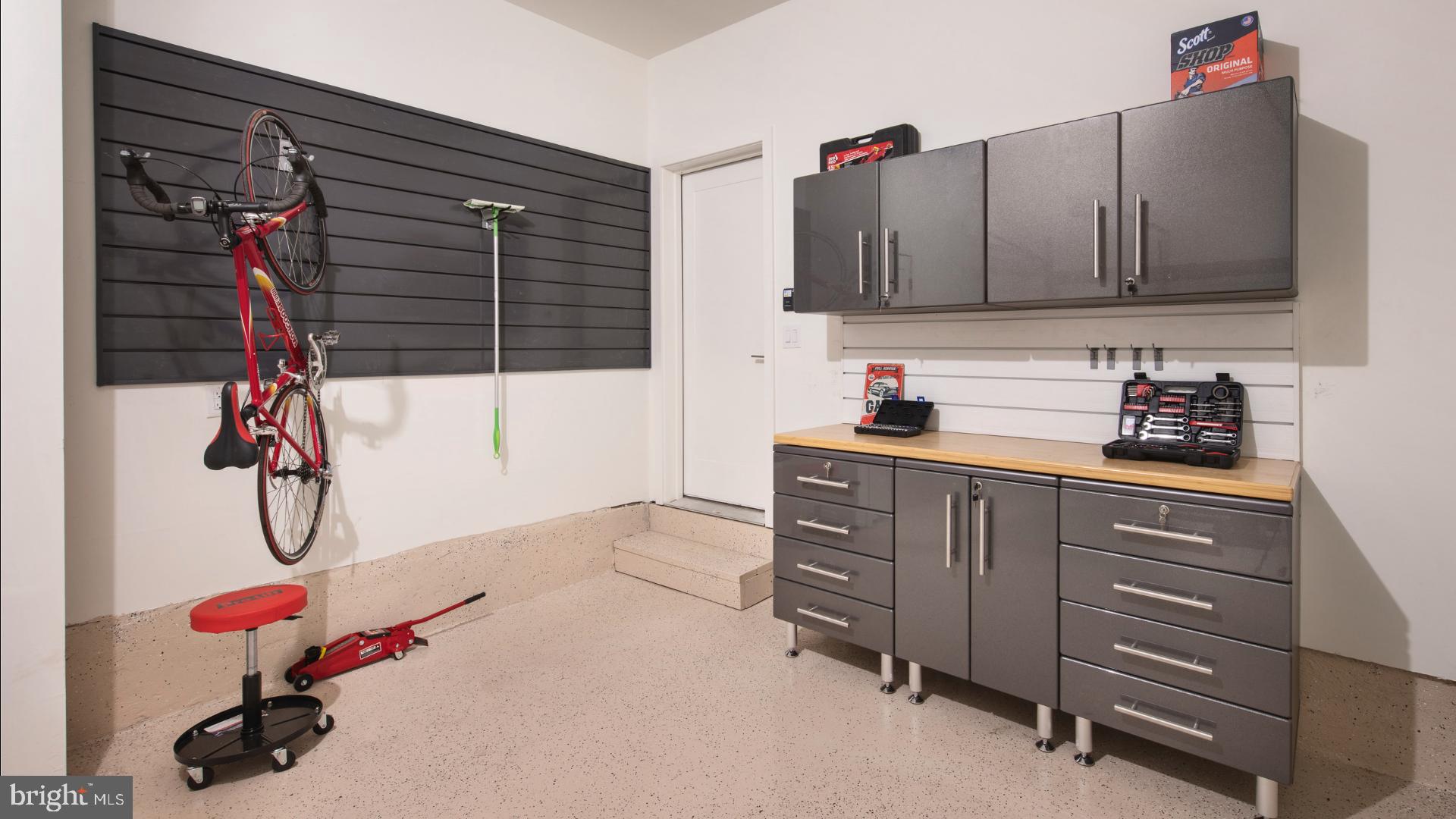 6103 Vivaldi Road Princeton, NJ 08540 - Photo 5 of 8 a kitchen with a sink and cabinets