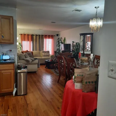 a living room with furniture window and wooden floor