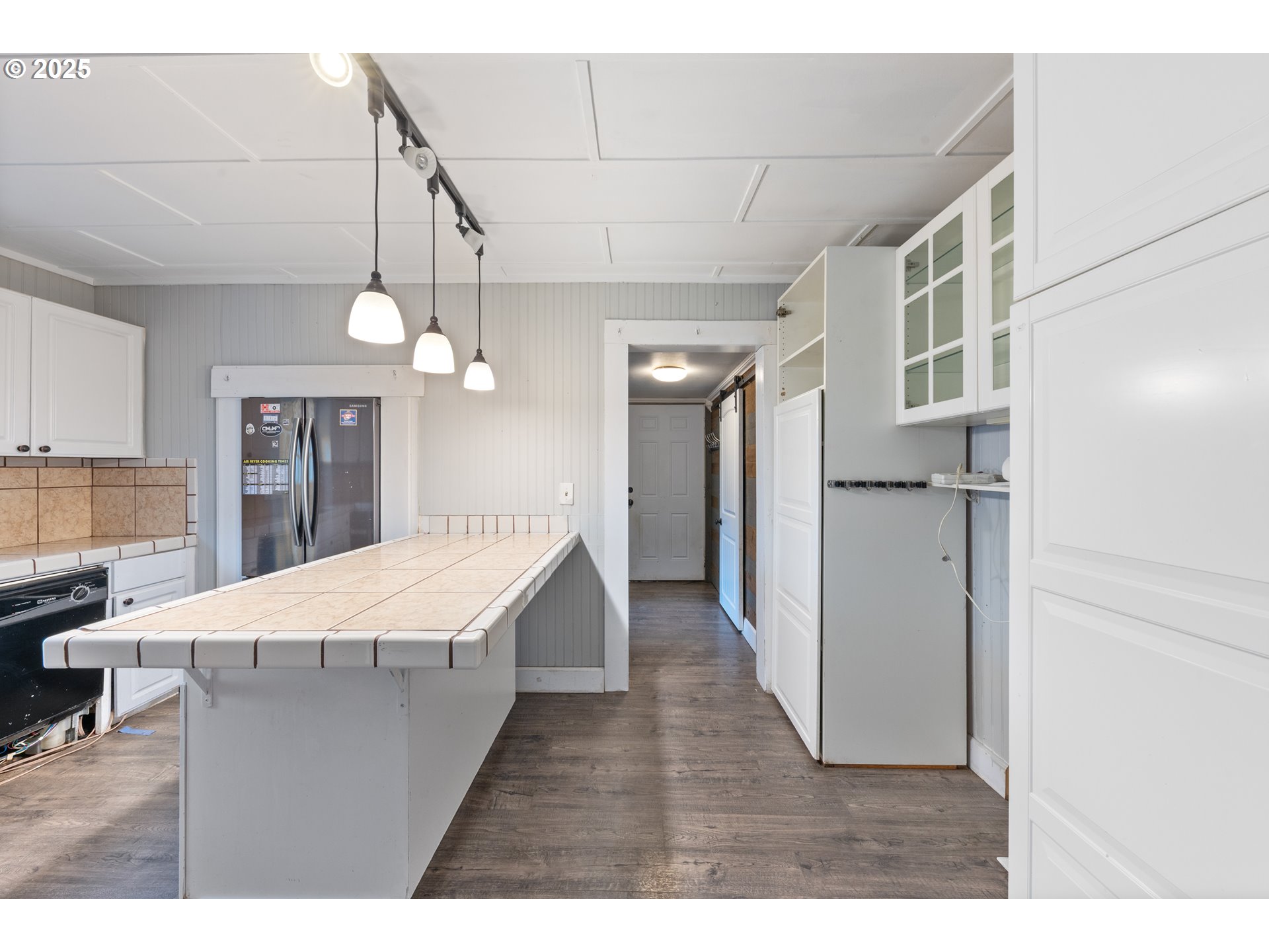 31778 Highway 213 Molalla, OR 97038 - Photo 12 of 47 a dining hall with stainless steel appliances kitchen island a chandelier
