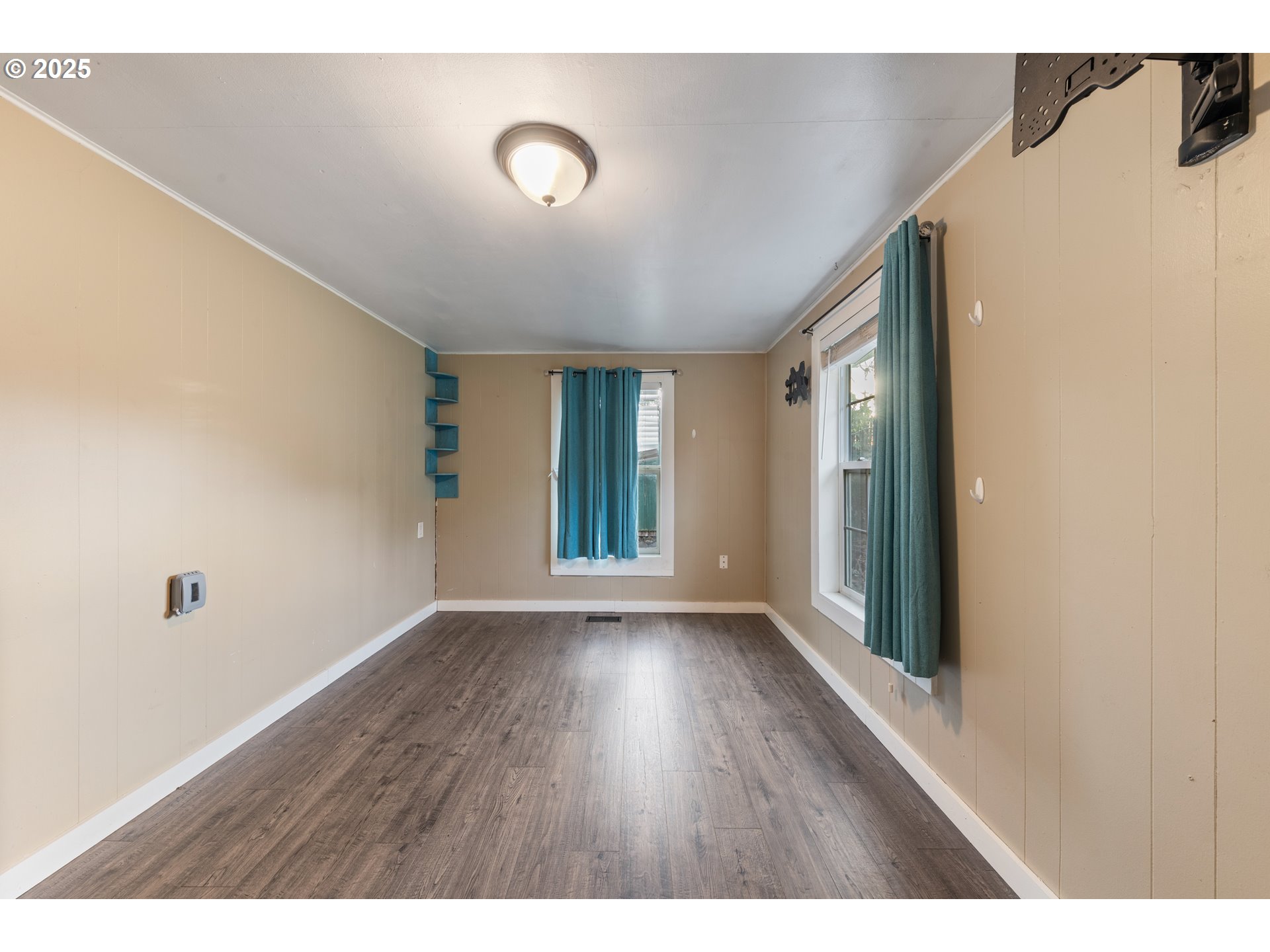 31778 Highway 213 Molalla, OR 97038 - Photo 17 of 47 a view of an empty room with wooden floor and a window