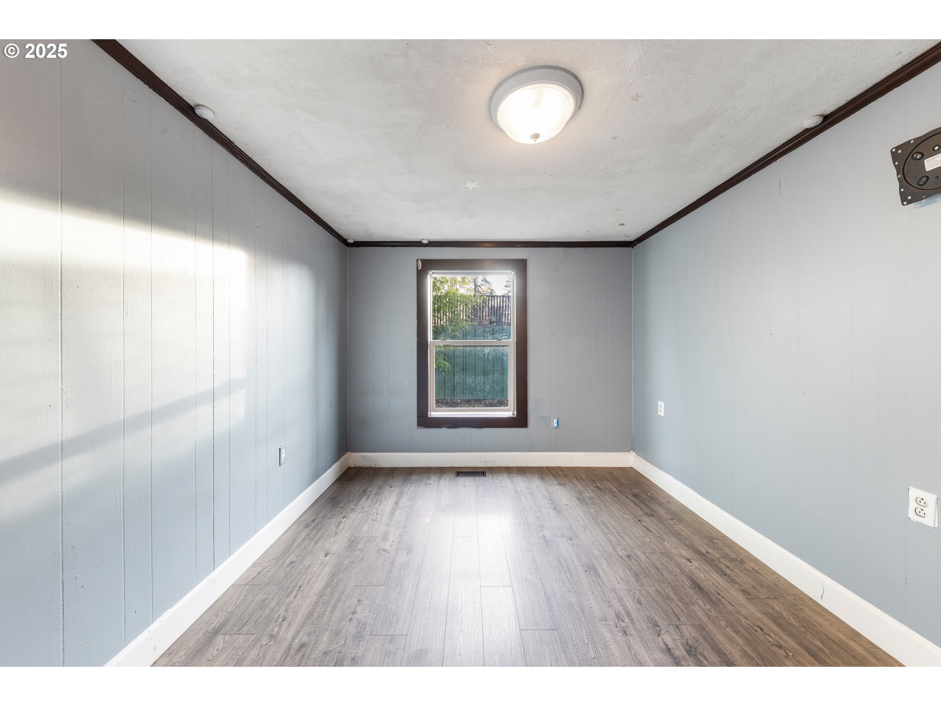 31778 Highway 213 Molalla, OR 97038 - Photo 18 of 47 a view of an empty room with wooden floor and a window