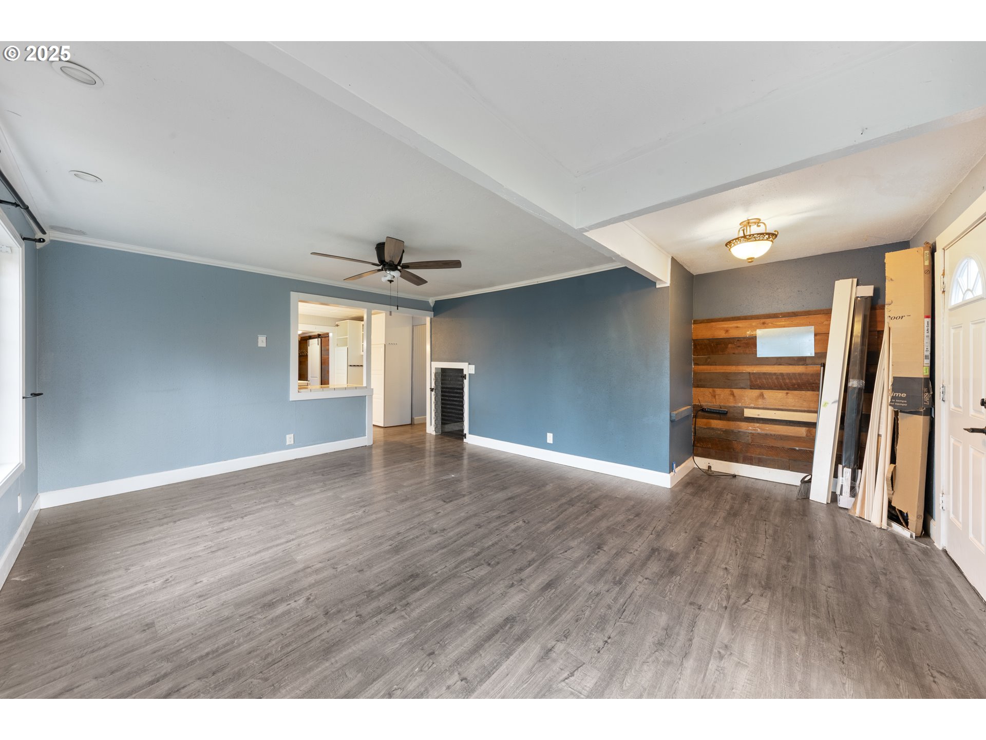 31778 Highway 213 Molalla, OR 97038 - Photo 6 of 47 a view of an empty room with a window and wooden floor