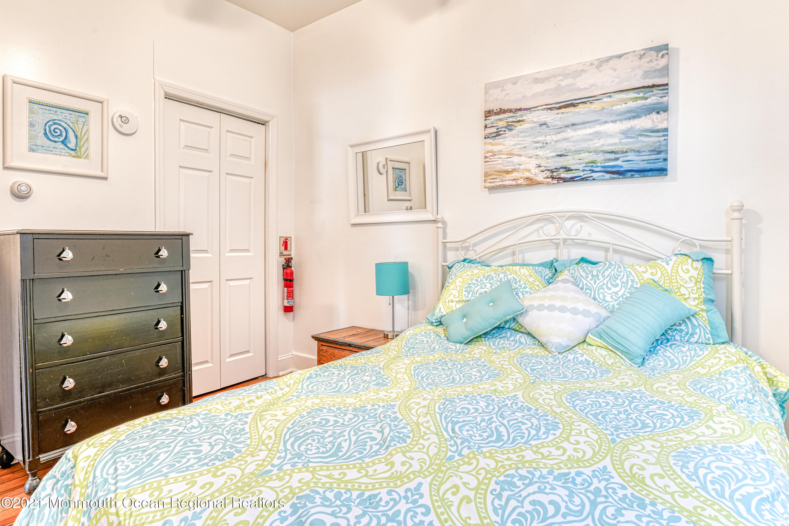 35 Ocean Pathway, Unit 1 Ocean Grove, NJ 07756 - Photo 12 of 14 a bedroom with a bed and a dresser