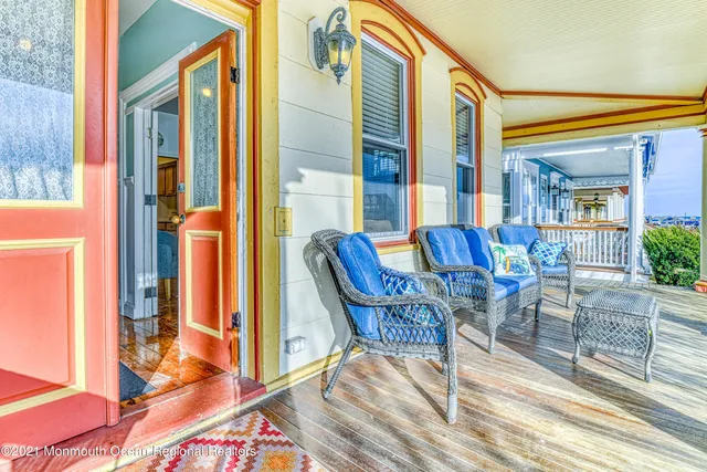 a view of two chairs in the balcony