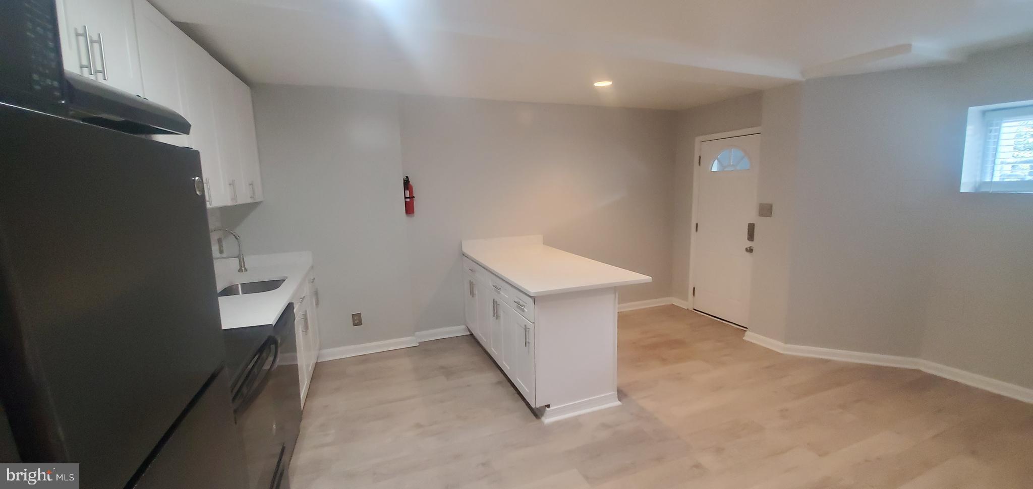 17 Quincy Place Northwest, Unit B Washington, DC 20001 - Photo 11 of 22 wooden floor in an empty room with a window