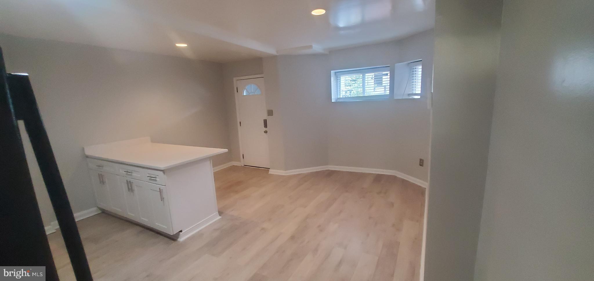 17 Quincy Place Northwest, Unit B Washington, DC 20001 - Photo 4 of 22 an empty room with windows