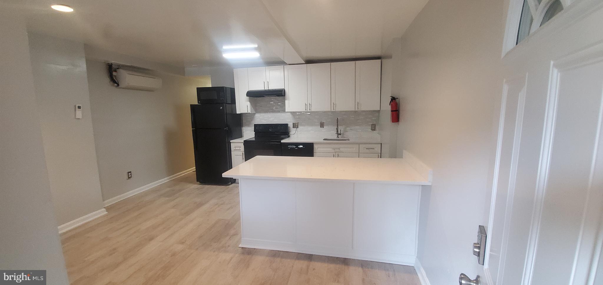 17 Quincy Place Northwest, Unit B Washington, DC 20001 - Photo 6 of 22 a view of kitchen with stainless steel appliances a refrigerator and a stove