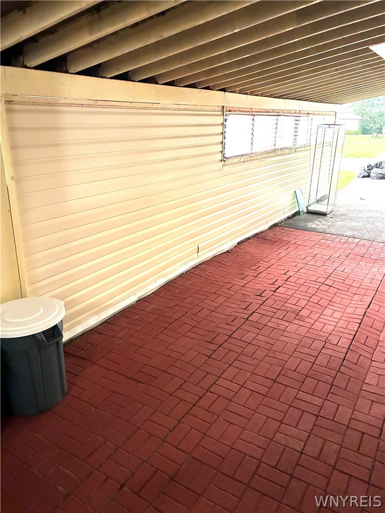 6035 South Transit Road Lockport Town, NY 14094 - Photo 26 of 32 PAVERS AND FRESHLY PAINTED CARPORT FLOOR