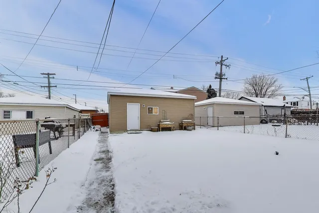 a view of a livingroom with furniture and a window