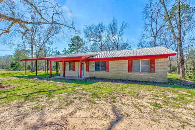 a view of swimming pool with a yard
