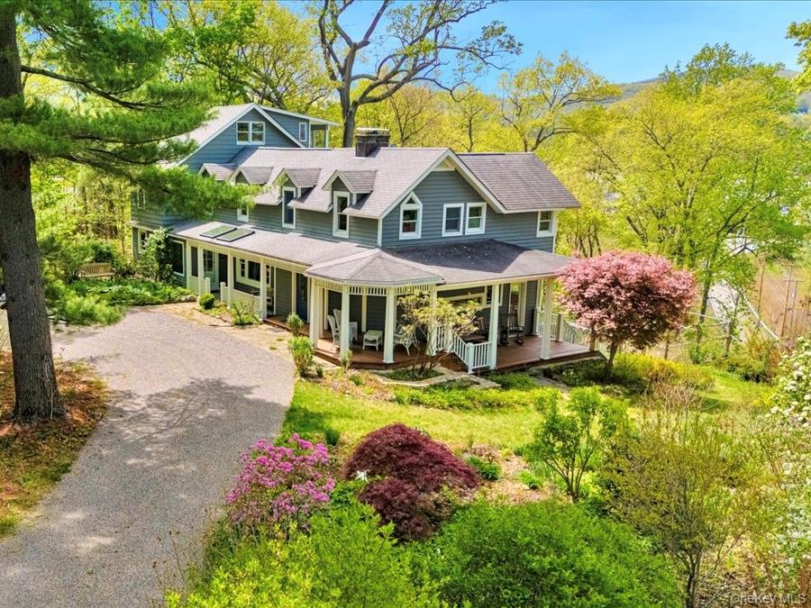 Front of property accessed from elegant circular drive