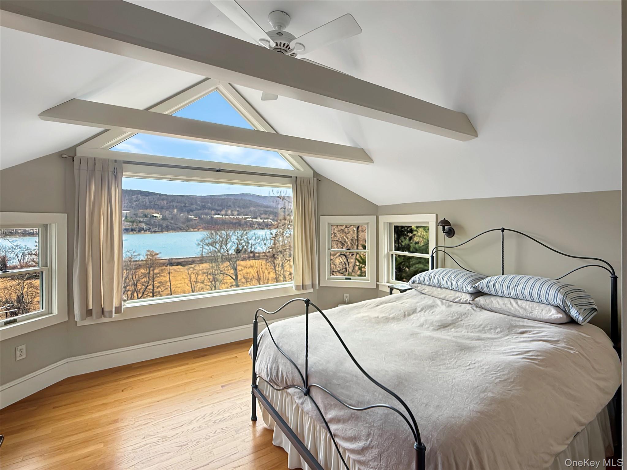 8 Manitou Ridge Garrison, NY 10524 - Photo 18 of 32 a bedroom with a large bed and a large window with the outer view