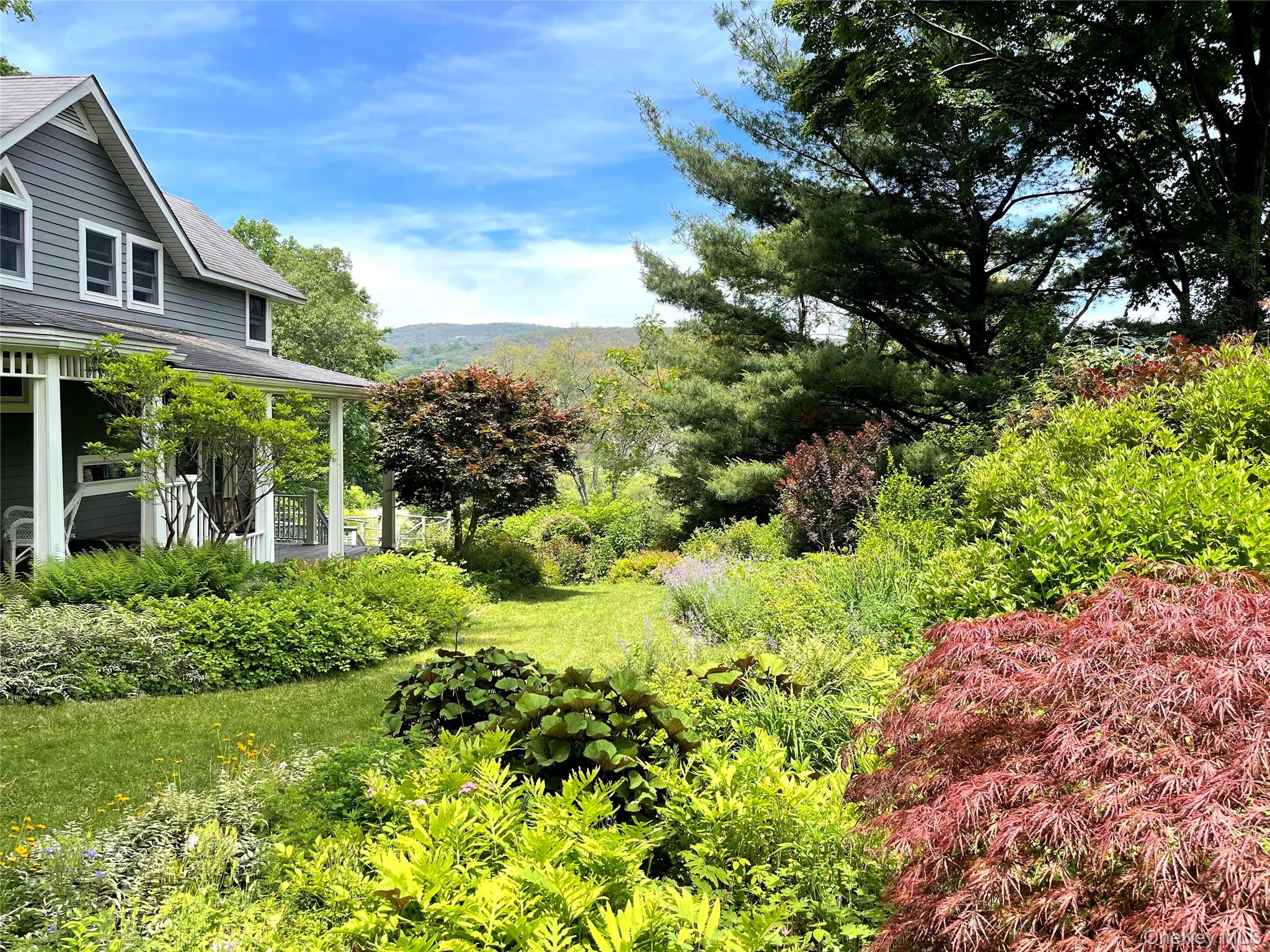 8 Manitou Ridge Garrison, NY 10524 - Photo 2 of 32 Beautifully landscaped grounds featuring mature specimen trees, amazing perennial gardens and stone walls