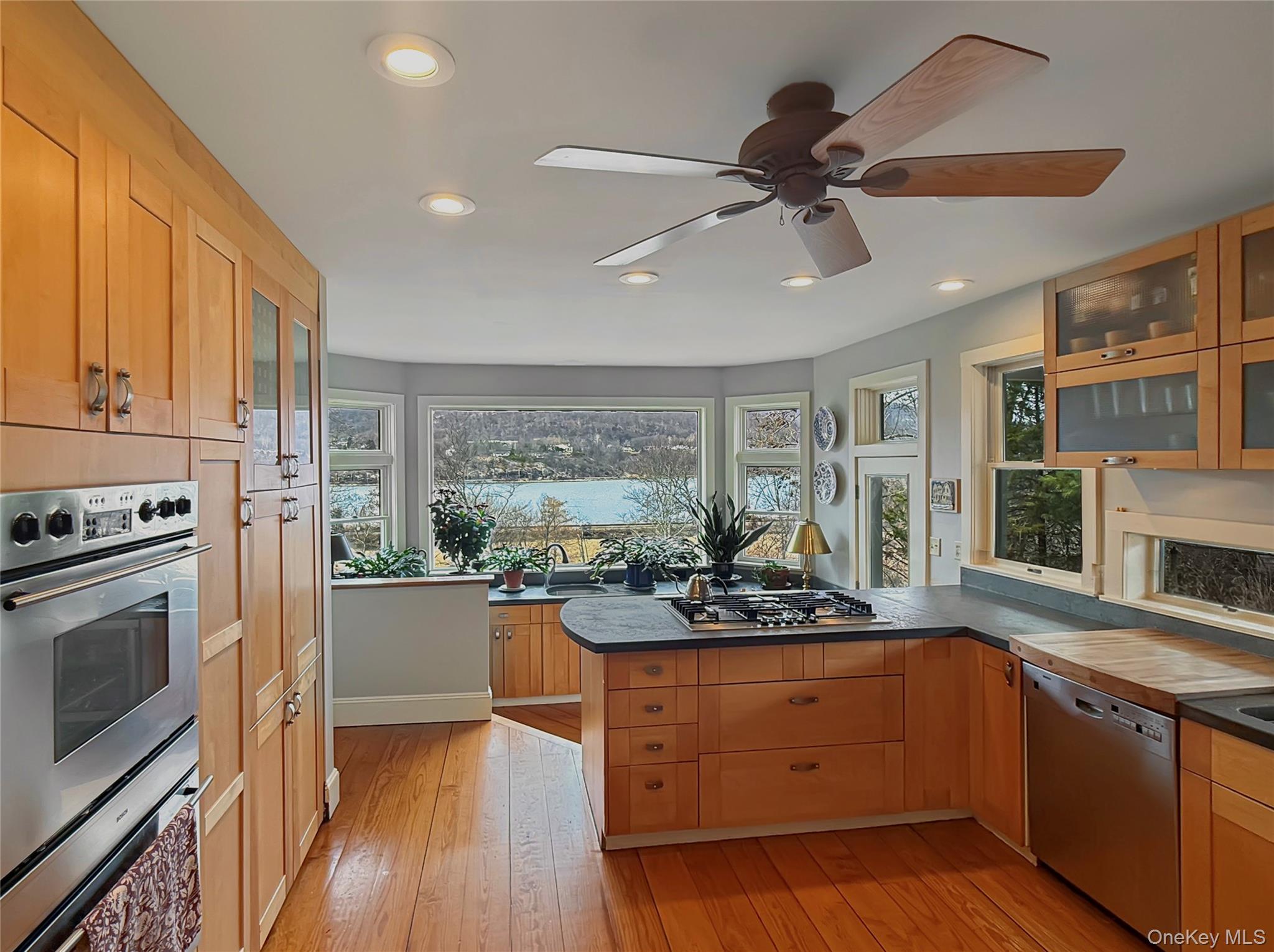 8 Manitou Ridge Garrison, NY 10524 - Photo 5 of 32 Kitchen with river views and hardwood floors, custom concrete counters and stainless steel appliances