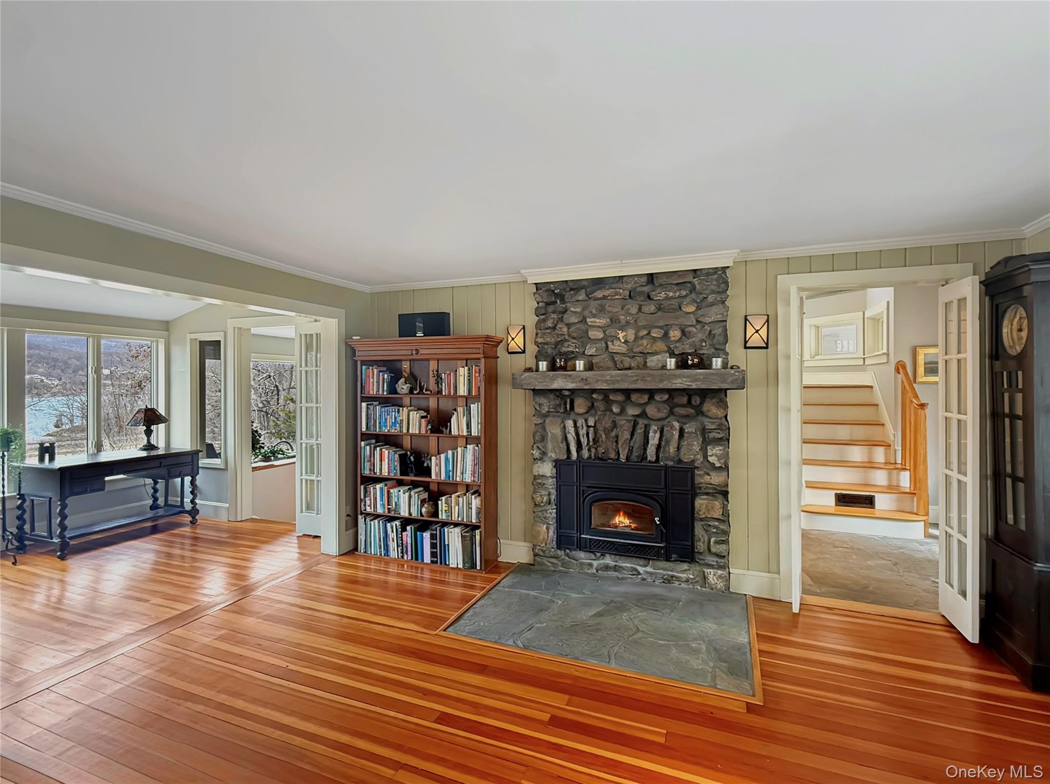 8 Manitou Ridge Garrison, NY 10524 - Photo 10 of 32 Striking stone fireplace with energy-efficient wood-burning insert