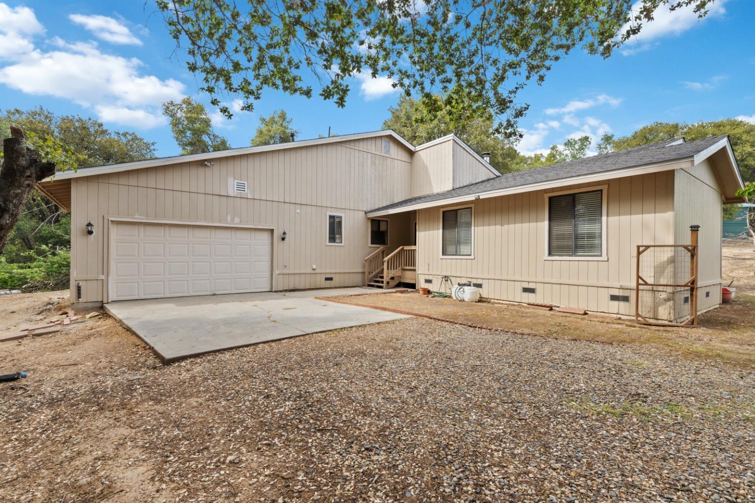 40809 Jean Road West Oakhurst, CA 93644 - Photo 12 of 39 a house view with a backyard space