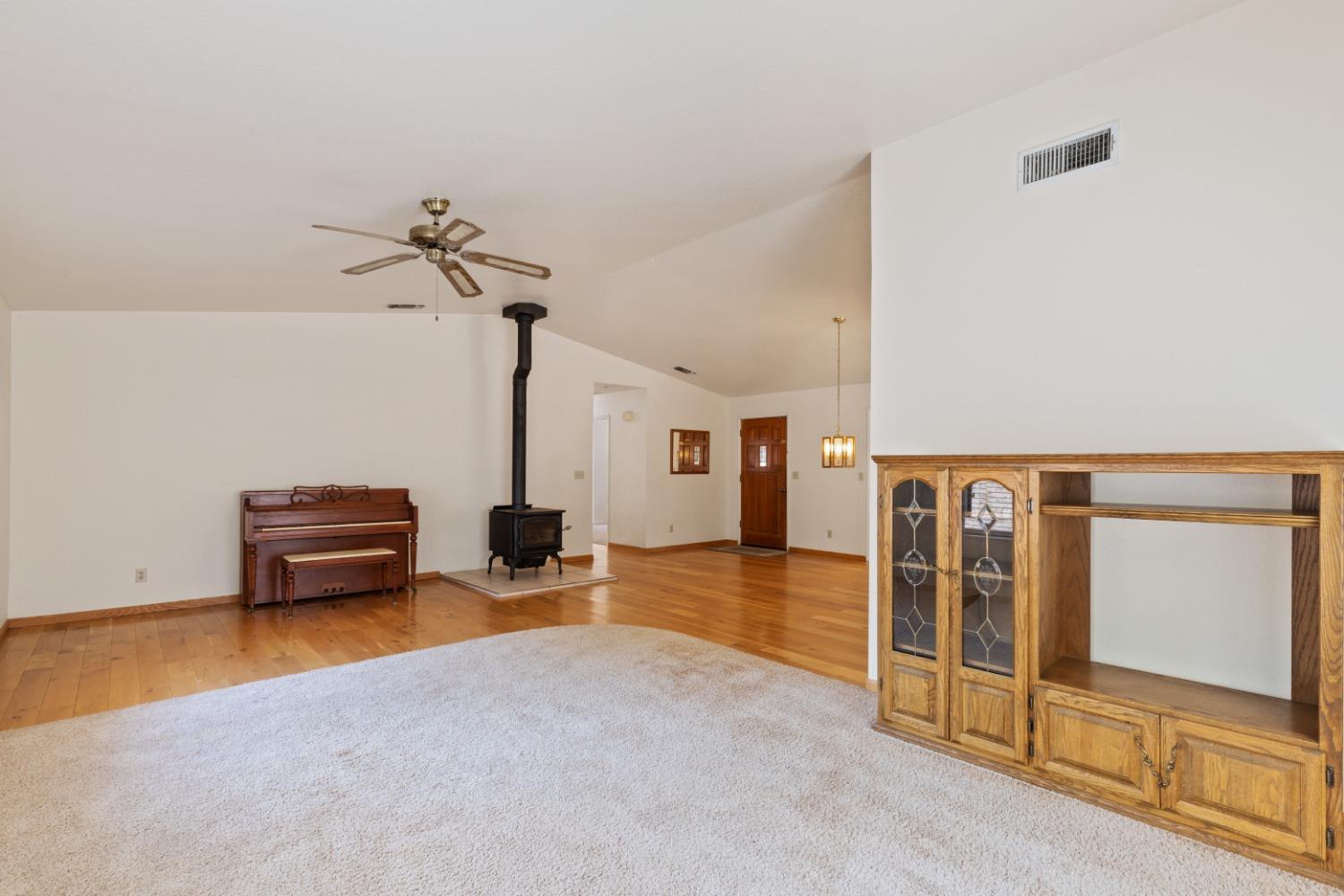 40809 Jean Road West Oakhurst, CA 93644 - Photo 22 of 39 a bedroom with furniture and a ceiling fan