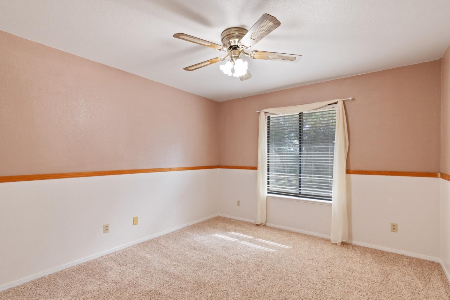40809 Jean Road West Oakhurst, CA 93644 - Photo 26 of 39 an empty room with windows and fan
