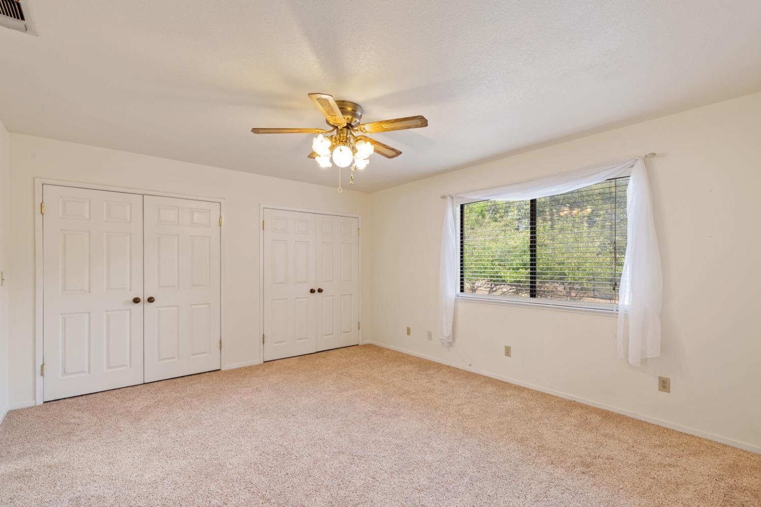 40809 Jean Road West Oakhurst, CA 93644 - Photo 27 of 39 a view of an empty room with a window
