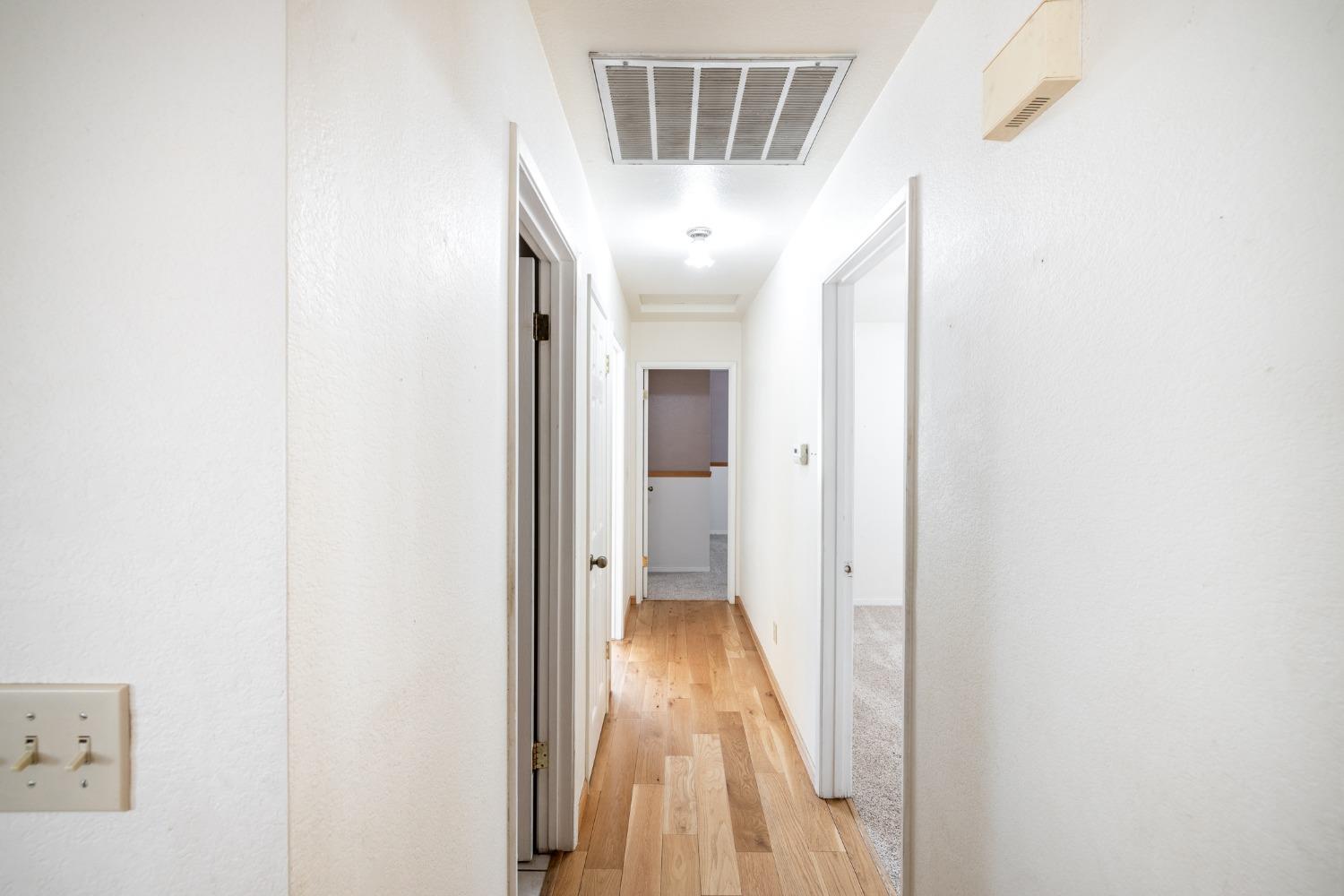 40809 Jean Road West Oakhurst, CA 93644 - Photo 30 of 39 a view of hallway with wooden floor