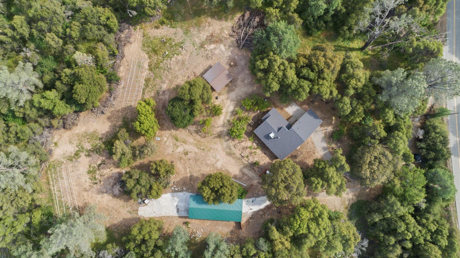 40809 Jean Road West Oakhurst, CA 93644 - Photo 3 of 39 an aerial view of a house with a yard and lake view