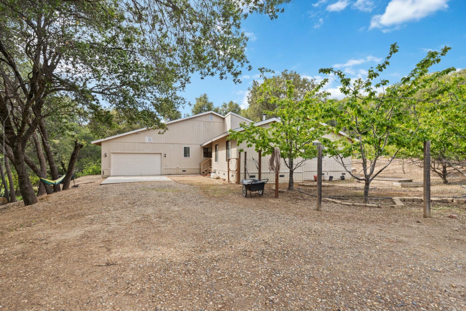 40809 Jean Road West Oakhurst, CA 93644 - Photo 9 of 39 a view of a house with a tree and plant