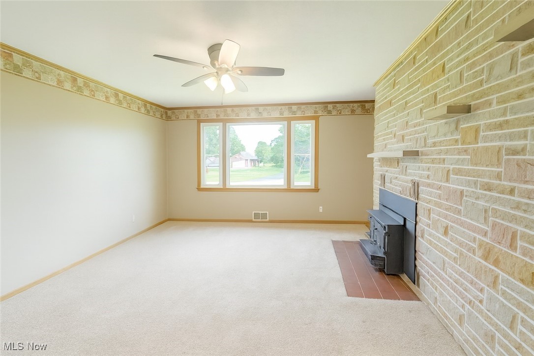3198 Erhart Road Litchfield, OH 44253 - Photo 10 of 16 Family room with second fireplace.