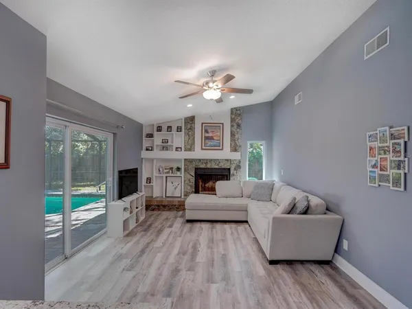 a living room with furniture and a fireplace