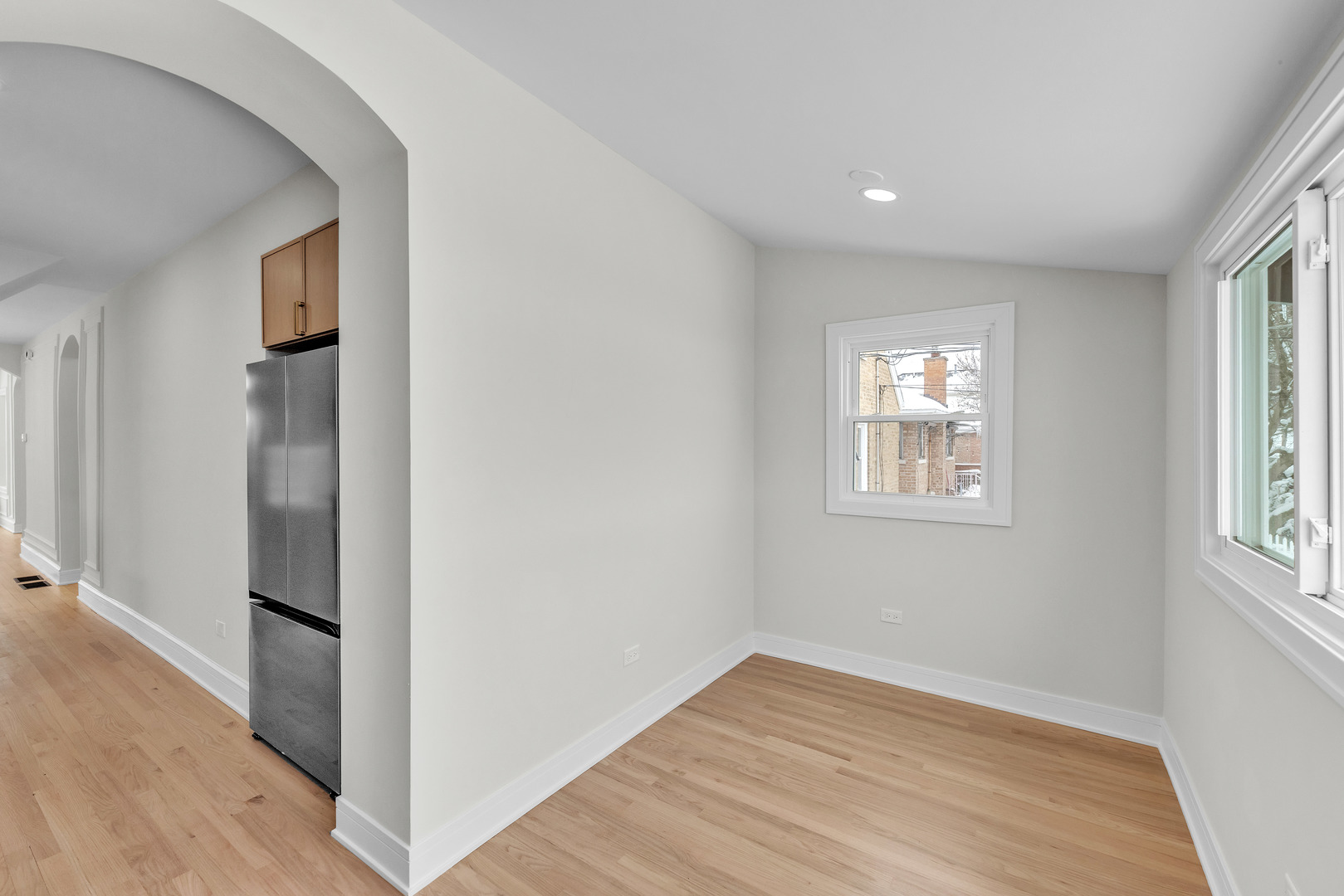2513 Keystone Avenue North Riverside, IL 60546 - Photo 16 of 32 an empty room with wooden floor and windows