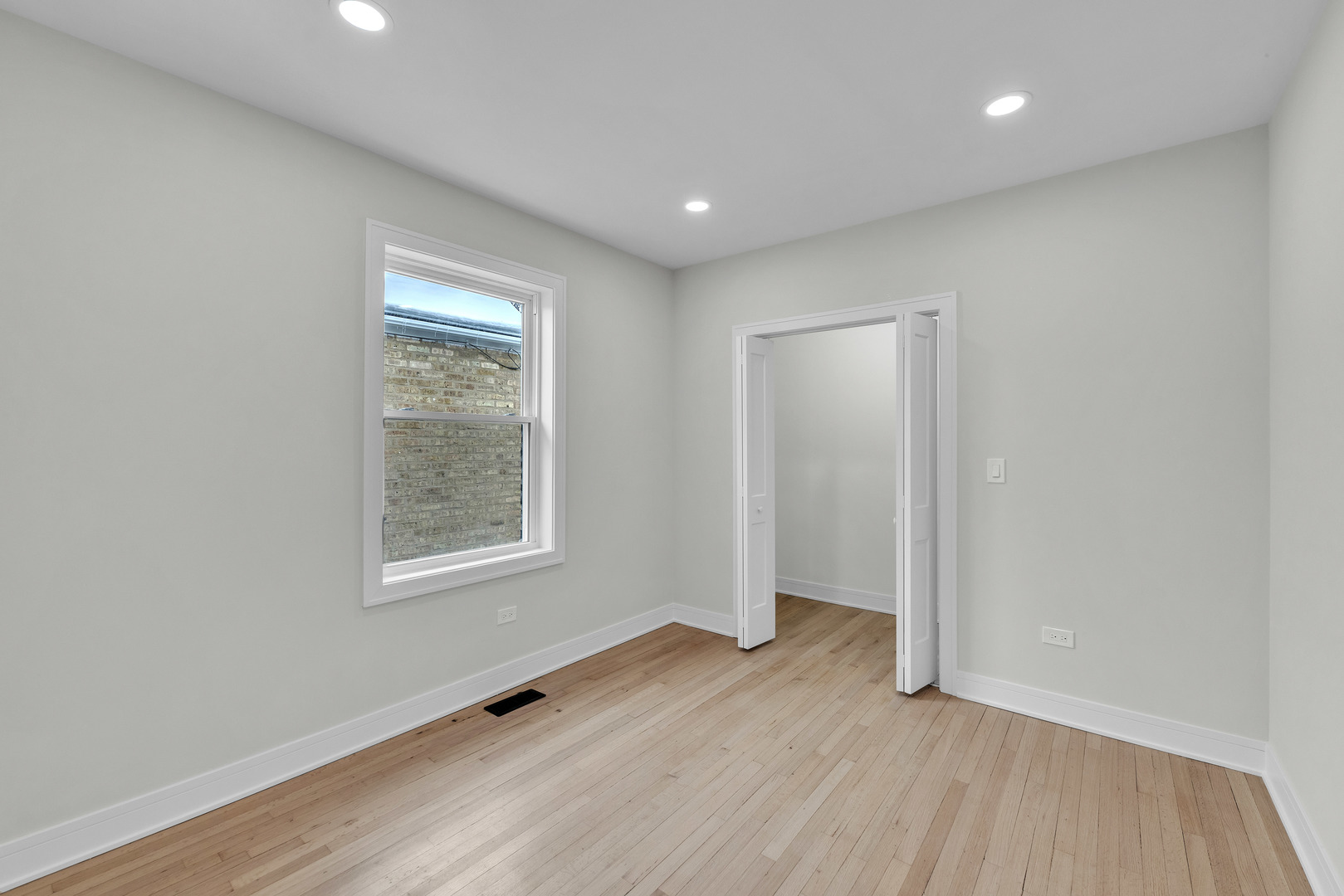 2513 Keystone Avenue North Riverside, IL 60546 - Photo 8 of 32 an empty room with wooden floor and windows
