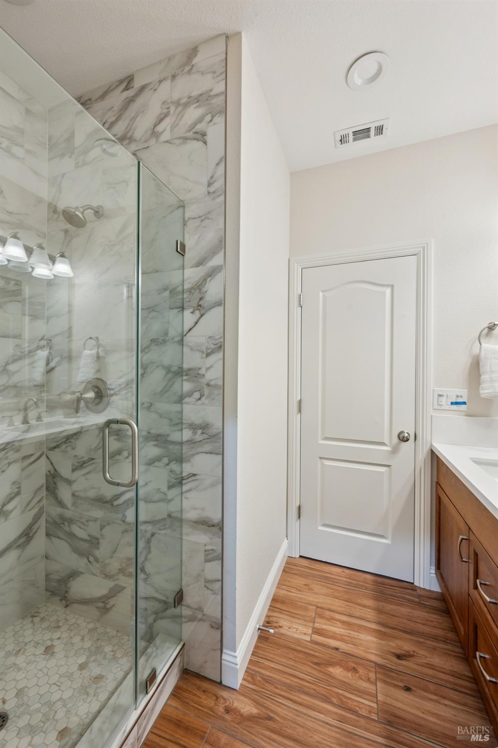 4665 Upper Ridge Road Santa Rosa, CA 95404 - Photo 26 of 71 a bathroom with a shower and a sink