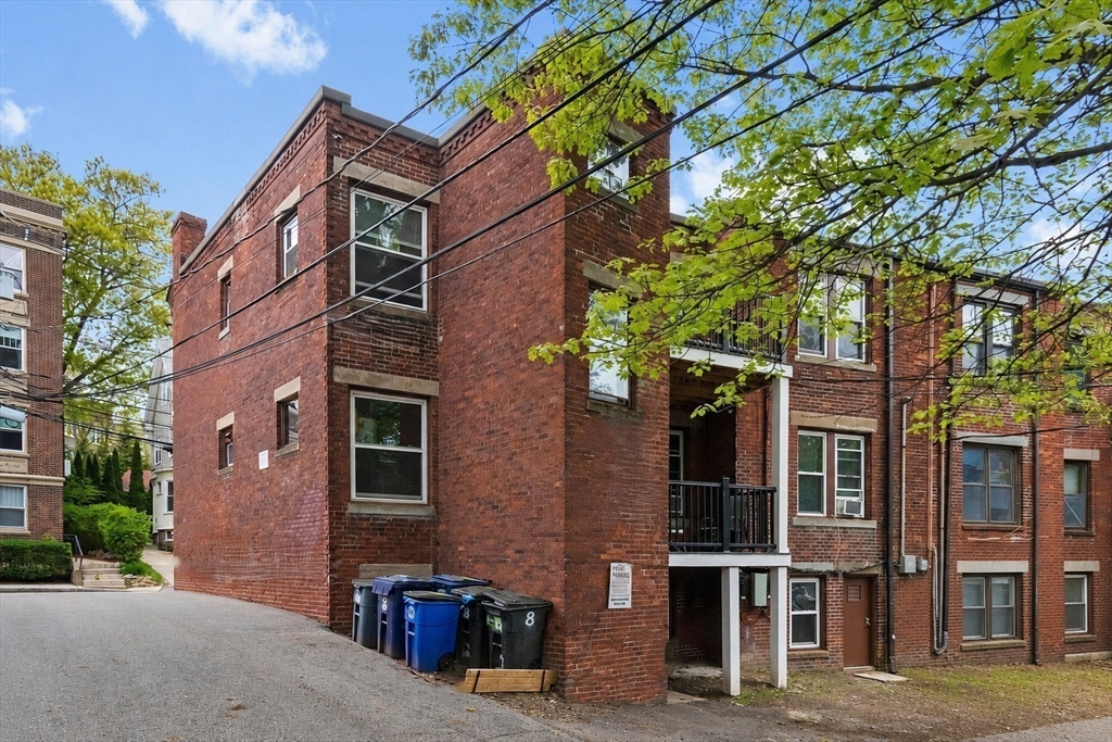 8 Colliston Road Boston, MA 02135 - Photo 33 of 40 a view of a brick building next to a road