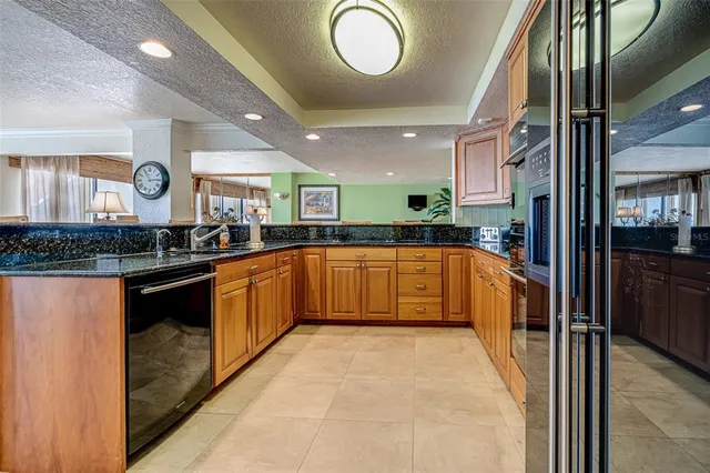 a view of a chairs and table in the balcony