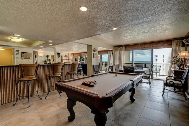 a bedroom with a bed and a flat screen television