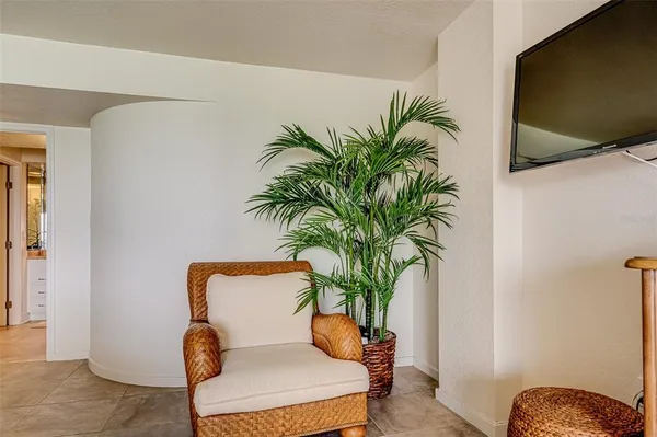 a bedroom with two beds and a large mirror on dresser