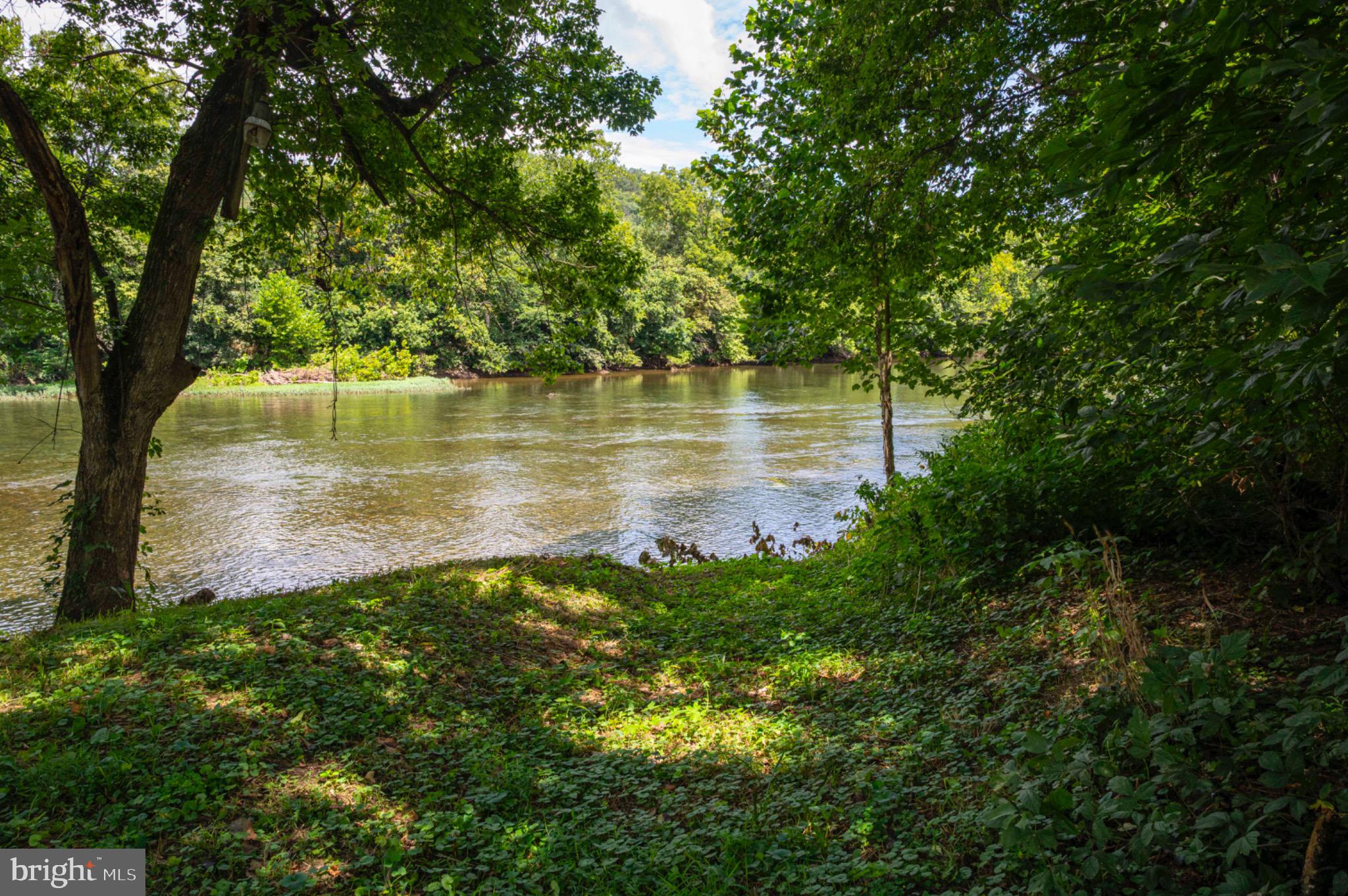 20 Burma Road Front Royal, VA 22630 - Photo 1 of 25 Serene riverside retreat with lush greenery.