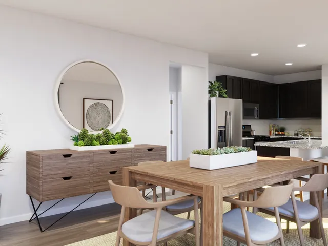 a bathroom with a granite countertop sink toilet and mirror