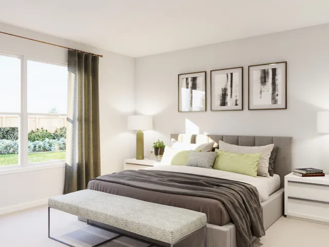 a spacious bedroom with a bed and a window