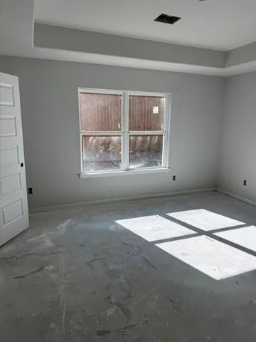 an empty room with windows