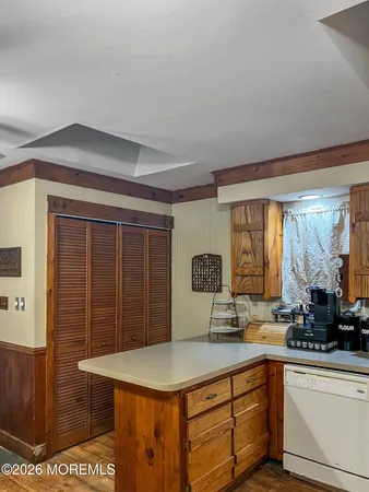 a kitchen with a sink a stove and cabinets