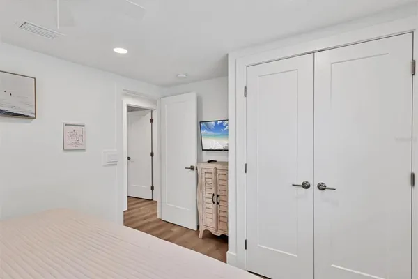 a en suite bathroom with a granite countertop tub sink and mirror