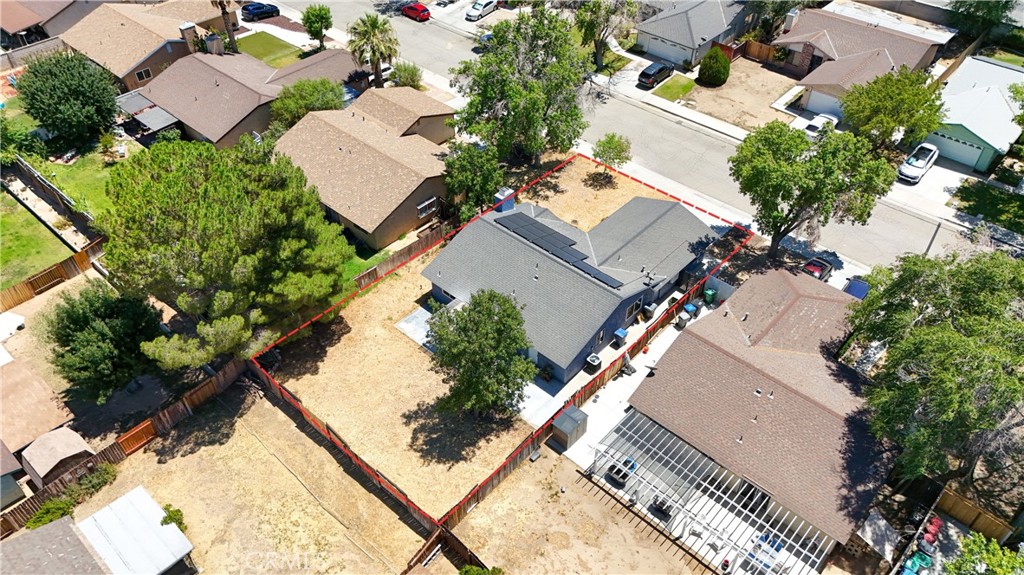 1025 Lightcap Street Lancaster, CA 93535 - Photo 7 of 13 an aerial view of multiple houses with yard