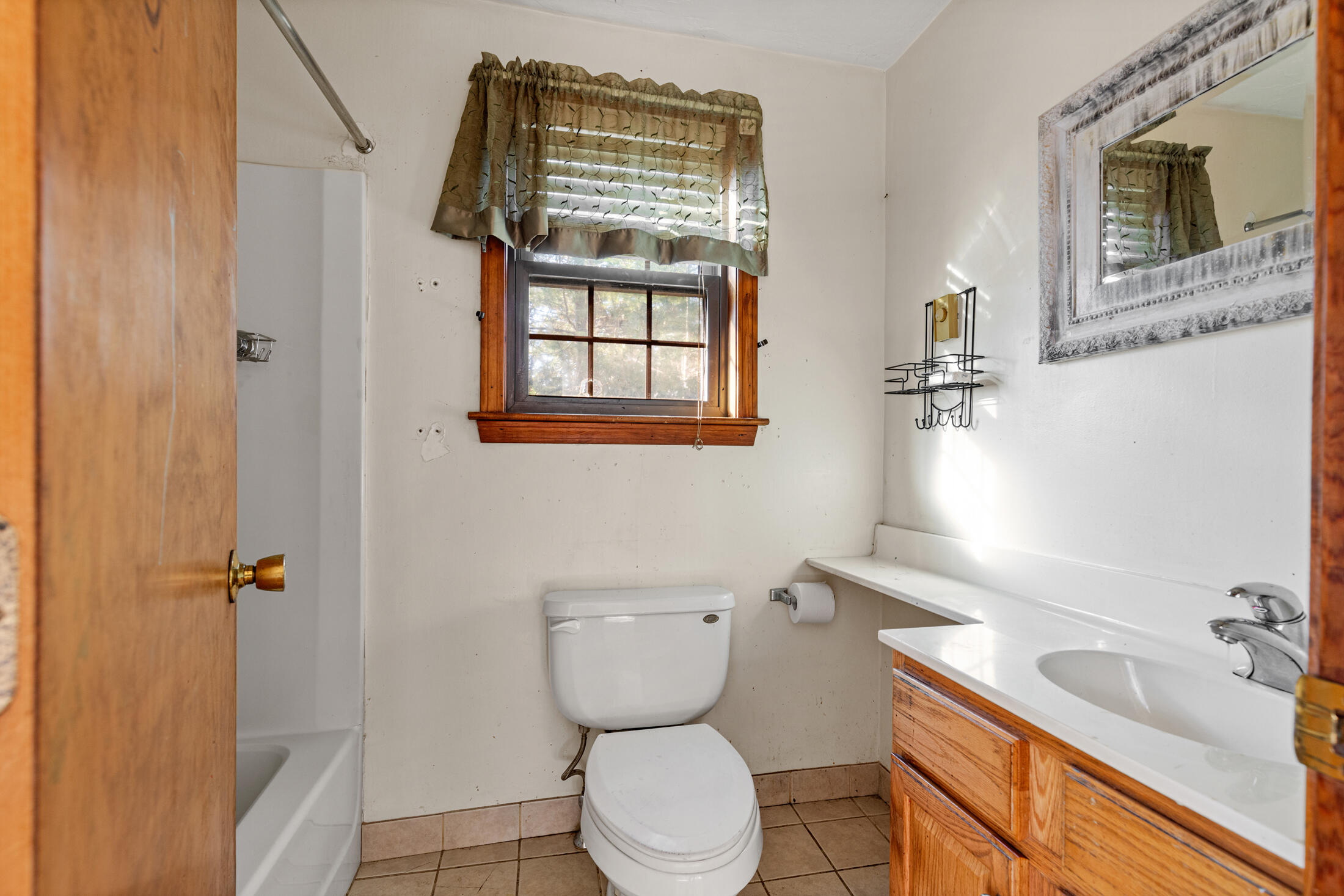 195 Falmouth Road, Unit 19F Mashpee, MA 02649 - Photo 19 of 25 a bathroom with a sink a toilet and shower