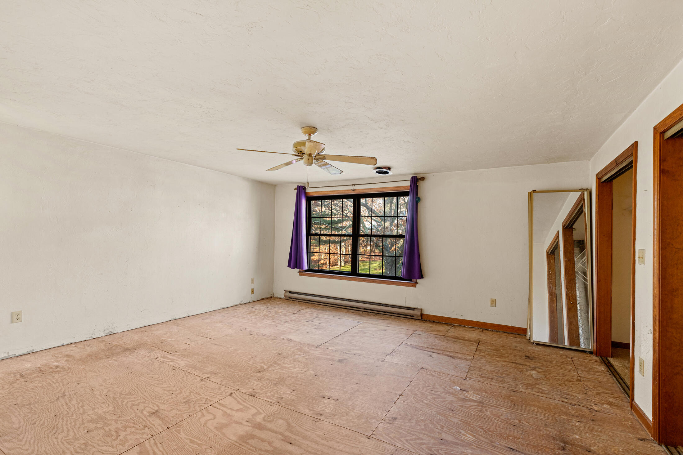 195 Falmouth Road, Unit 19F Mashpee, MA 02649 - Photo 20 of 25 an empty room with windows