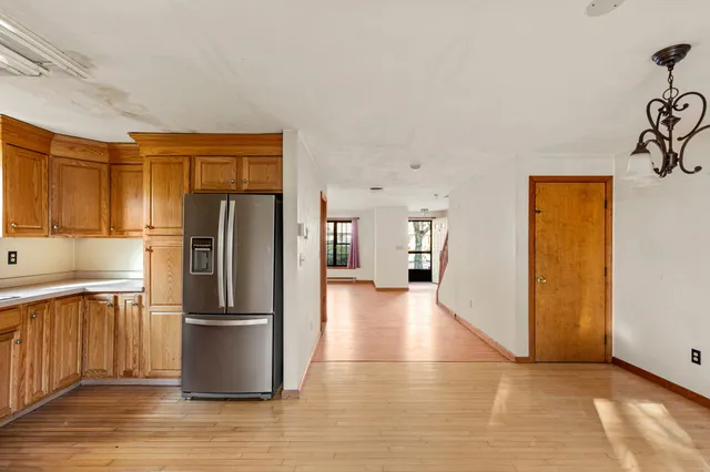 a kitchen with stainless steel appliances a refrigerator and a sink