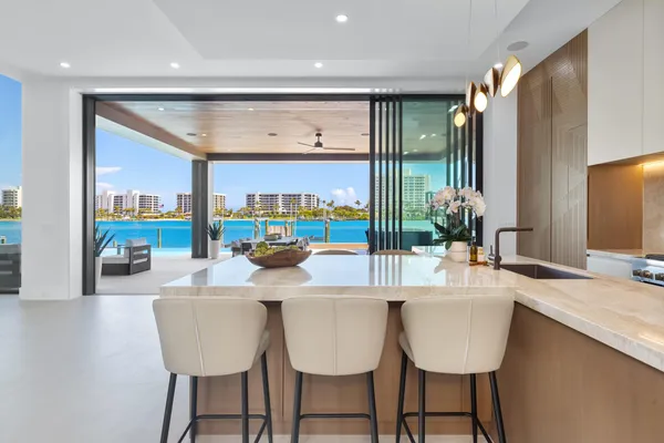 a view of an entryway with a flower pot and a window
