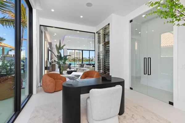 a view of a room with furniture and window