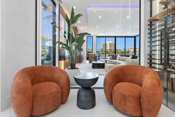 a room with pool tables and a chandelier