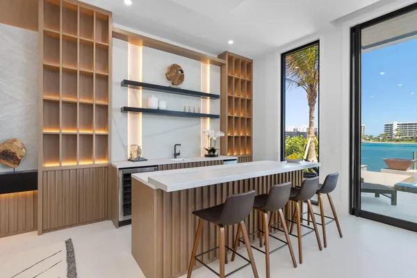 a dining room with furniture and chandelier