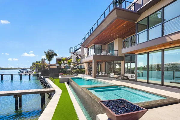 a view of a livingroom with a couch and windows